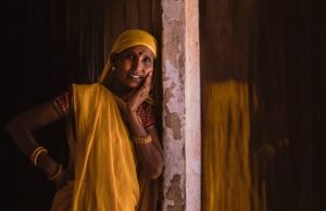 Traditional Woman leaning on wall