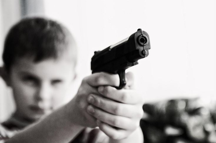 Kid holding a gun