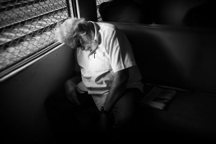 Old Man sleeping in a train