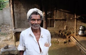 Man outside a village home
