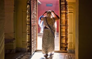 Woman in front of a door